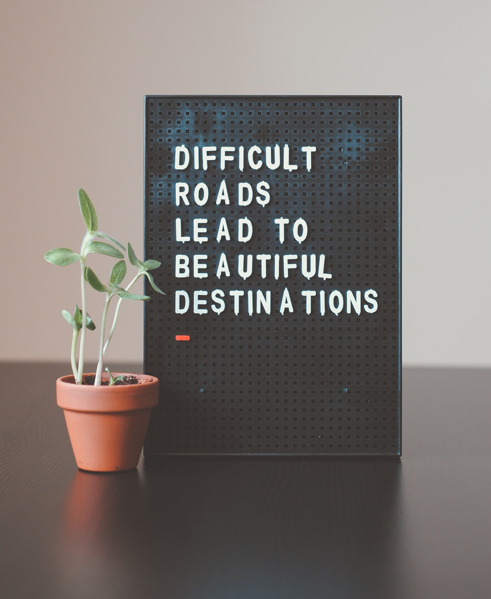 Photo by Hello I'm Nik difficult roads lead to beautiful destinations desk decor