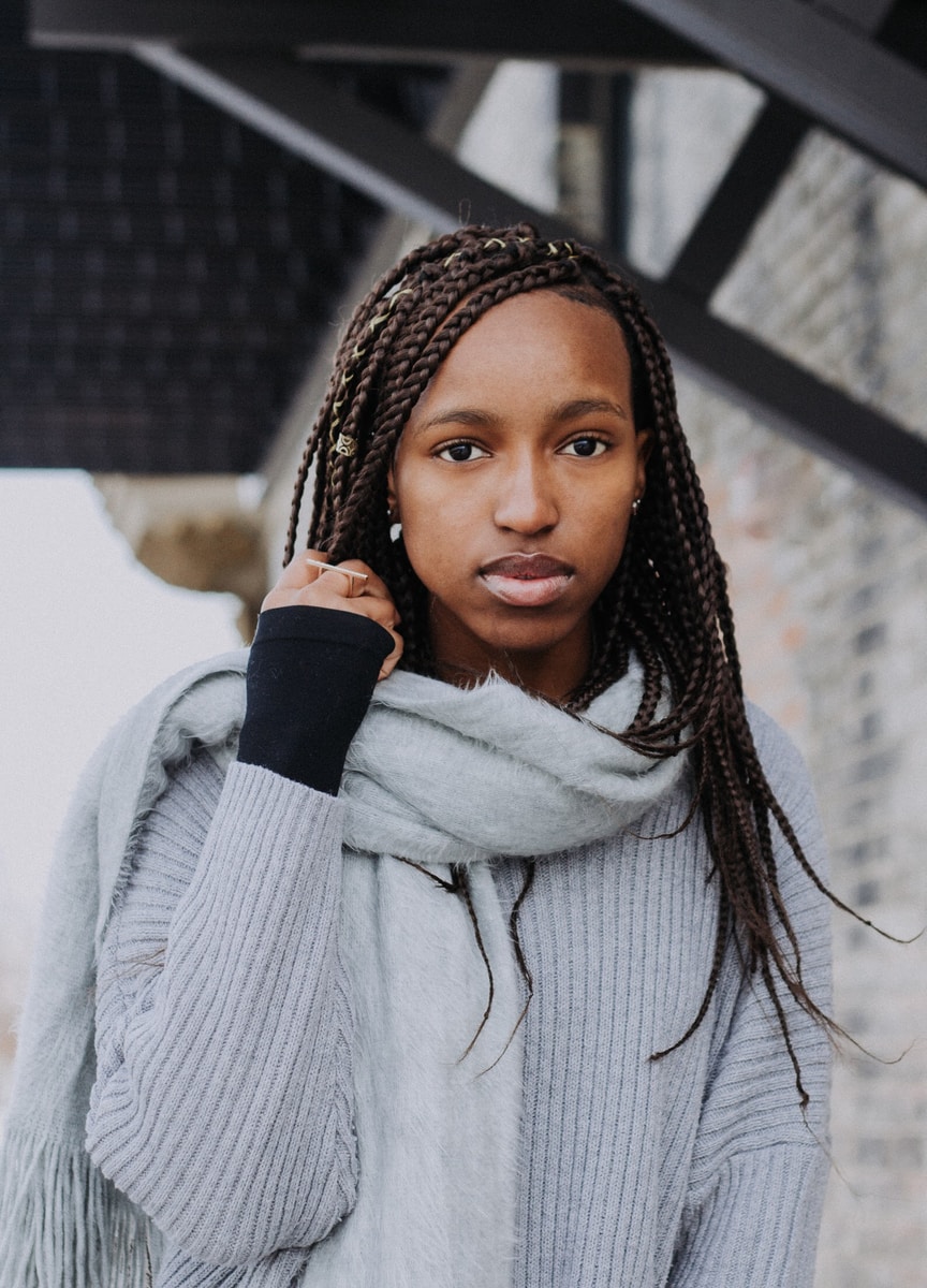 Photo by Joanna Nix-Walkup woman holding her braided hair